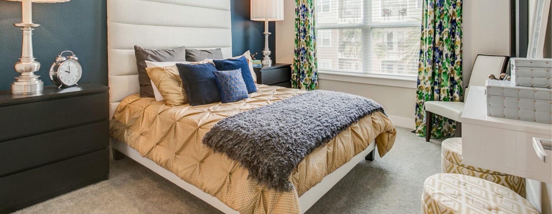 a bedroom with a bed and a fan