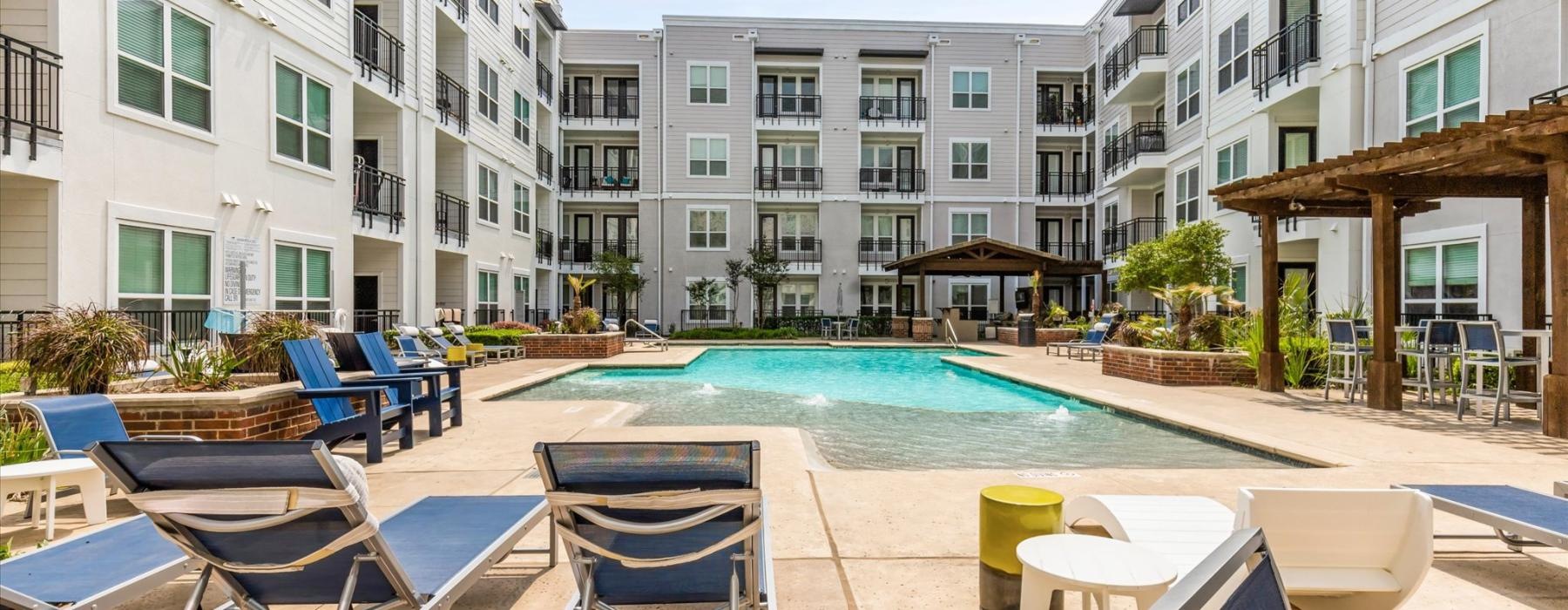 a pool with chairs around it