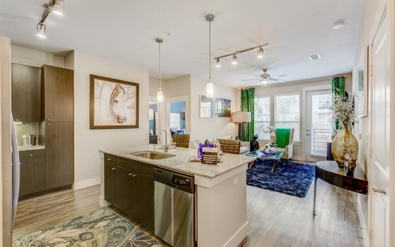 a kitchen with a marble island